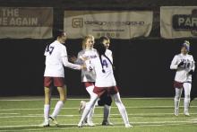(MIKE WILLIAMS | THE GRAHAM LEADER) The Lady Blues celebrate Macee Wilde's (top, middle) goal with 24:22 remaining in the second half of Friday's 9-1 loss to Wichita Falls High School at Memorial Stadium.