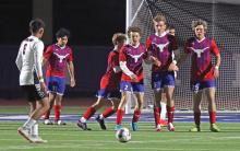 (THOMAS WALLNER | THE GRAHAM LEADER) Members of the Graham High School Steers soccer team block a free kick by the Mineral Wells Rams during a match Tuesday, March 4. Two local parents have brought in a club soccer program to help train the next generation of soccer players in Graham.