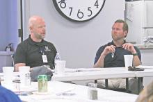 (TC GORDON | THE GRAHAM LEADER) Graham Regional Medical Center CEO Shane Kernell (left) speaks to the board during a recent meeting Wednesday, Sept. 25. The GRMC board approved the tax rate and budget for fiscal year 2025, as well as a three-year capital expenditure plan.