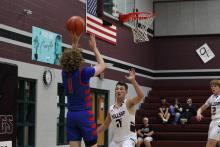 (ALEX HAVARDANKSY | THE GRAHAM LEADER) Tyler Allen attempts a midrange jumper Tuesday, Nov. 18 against the Millsap Bulldogs. Allen scored seven points in the Steers blowout win over the Millsap Bulldogs.