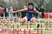 (MIKE WILLIAMS | THE GRAHAM LEADER) Zathin Reyes took first place in the 110m hurdles (pictured) and 300m hurdles Saturday, Feb. 25 at the Ram Relays in Mineral Wells. He also finished second overall in the long jump during the season-opening track meet.