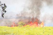 (TC GORDON | THE GRAHAM LEADER) Volunteer Fire Departments and other emergency personnel respond to a grass fire Wednesday, Oct. 9 on FM 61 south of Burch Road. Young County Commissioners voted to implement a burn ban which went into effect Tuesday, Oct. 15 and will expire in 90 days, unless commissioners remove it earlier.