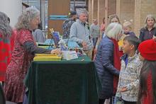 (THOMAS WALLNER | THE GRAHAM LEADER) Author Tabatha Waybright speaks with children at the Authors Day and Santa at the Library event in December 2024. Waybright will be returning along with 18 other authors Saturday, Dec. 6 .