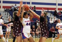 (ALEX HAVARDANSKY | THE GRAHAM LEADER) Gabbie Reyes fights the ball away from defenders in the Lady Blues’ matchup Thursday, Nov. 20. Reyes led the team in scoring in their opening match against City View at the Bowie tournament Monday, Nov. 24. 