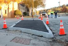(THOMAS WALLNER | THE GRAHAM LEADER) An extended curb at Third and Cherry Street where a stop sign will be placed as part of redesign to make the intersection a four-way stop. Work is underway to complete that project with city of Graham crews.