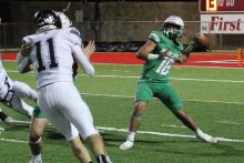 (ALEX HAVARDANKSY | THE GRAHAM LEADER) Keyton Newland launches a ball down the field Friday, Nov. 21 against the Water Valley Wildcats. Newland threw the first touchdown pass of the day for the Bobcats to Keegen Voyles.
