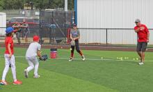 (ALEX HAVARDANSKY | THE GRAHAM LEADER) Adam Arrington runs drills with Steers campers for Steers baseball camp Tuesday, June 3. Arrington serves as the Lady Blues softball head coach.