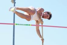 (ALEX HAVARDANSKY | THE GRAHAM LEADER) Rylan Monsley soars during the pole vault event at the area meet Friday, April 11. Monsey finished fourth in the event and will advance to regionals. 
