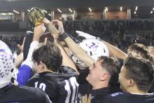 (ALEX HAVARDANSKY | THE GRAHAM LEADER) The Steers celebrate with their area championship trophy Friday, Nov. 21. The Graham Leader will continue to look at sports highlights from July to December 2025 in the Saturday, Jan. 3 edition.