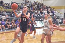 (TC GORDON | THE GRAHAM LEADER) The Lady Blues’ Fayth Bryer elevates for a wide open layup past Haskell’s defense Tuesday, Nov. 5 in Graham’s 44-37 season-opening win.