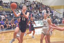 (ARCHIVE PHOTO | THE GRAHAM LEADER) The Lady Blues’ Fayth Bryer elevates for a wide open layup past Haskell’s defense earlier in the season. The Lady Blues won three of four games at a tournament last weekend in Haskell.