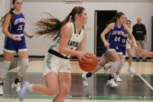 (ALEX HAVARDANSKY | THE GRAHAM LEADER) Camren Mallory takes the ball up the court in one of the Ladycats’ previous matchups. The Ladycats defeated the Woodson Cowgirls in a matchup Thursday, Jan. 22 by a score of 42-23. Mallory scored nine points in the contest. 