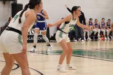 (ALEX HAVARDANSKY | THE GRAHAM LEADER) Rae’Lynn Bennett, 15, and Emma Hawkins, 11, play up on defense in one of the Ladycats’ previous matchups. The Ladycats fought hard Friday, Dec. 12 but lost to the Lady Eagles 37-17. 