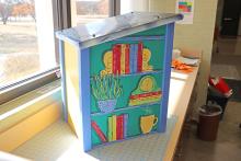 (THOMAS WALLNER | THE GRAHAM LEADER) The Free Little Library donated by the Graham Girls Book Club which will be included at one of three locations around Graham. Three Free Little Libraries will be placed at Firemen’s Park, Fisher Street Park and near the Graham Municipal Swimming Pool.