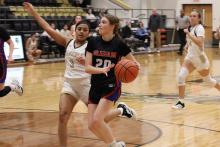 (ALEX HAVARDANSKY | THE GRAHAM LEADER) Katy McGehee drives to the basket for a layup Thursday, Dec. 4 against Haskell. The Lady Blues fought hard but lost to the Lady Indians 43-38 during their tournament matchup. 
