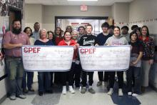 (ALEX HAVARDANSKY | THE GRAHAM LEADER) Two grants for the Gizmos and UT OnRamps programs were presented to Graham High School by the Graham Public Education Foundation during their prize patrol distribution Thursday, Dec. 11.