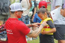 (ARCHIVE PHOTO | THE GRAHAM LEADER) A child is fitted for a life jacket during the Family Fun and Fishing event in 2024. There will be a life jacket fitting from the Remembering Wyatt Dale Water Safety organization Saturday, June 21.