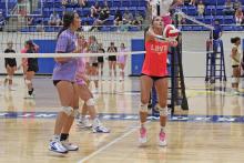 (ALEX HAVARDANSKY | THE GRAHAM LEADER) Emily Hughes sets a pass for the Lady Blues in their match Thursday, July 24. Hughes and her sister, Kathryn Hughes, look to be a pivotal part of the Lady Blues this season.