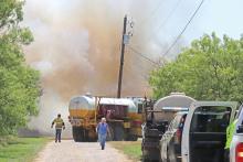 (ARCHIVE PHOTO | THE GRAHAM LEADER) Young County volunteer fire department units arrive to help contain a structure  fire in June 2024. Due to current conditions in the state, Young County Judge Win Graham enacted a burn ban Monday, March 3.