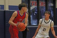 (ALEX HAVARDANSKY | THE GRAHAM LEADER) Brodie Martin looks to pass the ball to one of his teammates in one of the Steers previous matchups. Martin put up 12 points in the Steers 57-52 win Monday, Dec. 22 against the Vernon Lions. 