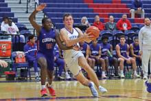 (THOMAS WALLNER | THE GRAHAM LEADER) Running past Abilene Cooper defenders, Ty Thompson looks to set up a shot Friday, Jan. 3.