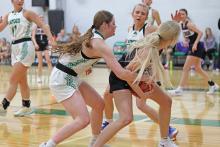 (THOMAS WALLNER | THE GRAHAM LEADER) Camren Mallory tries to steal possession of the ball during the Throckmorton district opener Friday, Jan. 3. Mallory had a total of six points in the game which ended with a big 59-28 win to open district play.