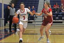 (ALEX HAVARDANSKY | THE GRAHAM LEADER) McKynley Corley dribble the ball passed a defender Tuesday, Dec. 16 against the Memorial Lady Mavericks. Corley scored two points in the Lady Blues 42-26 win over the Lady Pirates. 