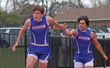 (ARCHIVE PHOTO | THE GRAHAM LEADER) Damien Noria passes the baton to Brodie Martin during the 4x100 Meter Relay at the PK Relays held Saturday, March 15. After spending last week in Springtown, Graham's teams traveled to Weatherford for the event Thursday, March 27.