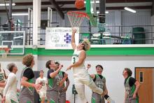 (ARCHIVE PHOTO | THE GRAHAM LEADER) Keyton Newland runs from behind the basket to lay up a shot in a game earlier in the season. The team secured their playoff spot after beating Garner in a tie-breaker match Friday, Feb. 14.