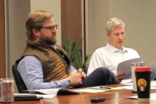 (ARCHIVE PHOTO | THE GRAHAM LEADER) Graham Assistant City Manager Grant Ingram (left) speaks to the Graham Economic Improvement Corporation Board of Directors regarding housing development Wednesday, Feb. 28.