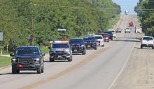 (THOMAS WALLNER | THE GRAHAM LEADER) Law enforcement officers escort retired K-9 Rocky to the Young County Sheriff’s Office to receive his final call before taking him to Faithful Companions Pet Crematory and Pet Cemetery of Strawn. Rocky served alongside his handler Devin Wright with YCSO.