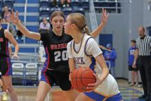 (ARCHIVE PHOTO | THE GRAHAM LEADER) Katy McGehee plays man to man defense on a player with the ball in one of the Lady Blues’ regular season games in 2024.