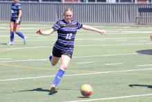 (ALEX HAVARDANSKY | THE GRAHAM LEADER) Jensen Pettus fields the ball in the first half for the Lady Blues game Thursday, March 20 against the Borger Lady Bulldogs. The team came home with a big 3-1 win and will move on to the next round of the playoffs.