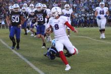 (ALEX HAVARDANKSY | THE GRAHAM LEADER) Jace Gill runs away from a Decatur defender Friday, Sept. 19, against the Eagles. Gill has led the way for the Steers offense so far this year.
