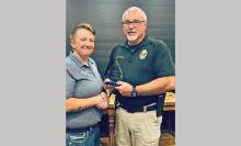 (OPD | CONTRIBUTED PHOTO) Olney Police Department Chief Dan Birbeck presents the first K-9 Corporal Miranda Wright Memorial Award to Graham Police Department Sgt. Hailey Calcote during the 2025 United States Police Canine Association, Inc. Annual K-9 Trials Awards Ceremony held Saturday, May 3.