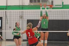 (ALEX HAVARDANSKY | THE GRAHAM LEADER) Kenzie King jumps up at the front of the net for a block attempt in one of the Ladycats matches. King had eight kills offensively in the Ladycats three set win over Bryson. 