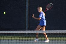 (ALEX HAVARDANKSY | THE GRAHAM LEADER) Kline Krupp prepares to swing at a ball in one of the Lady Blues’ matches in Tennis. Krupp, alongside her teammate Jade Dospapas, were able to score set points in their mixed doubles match against Canyon High. 