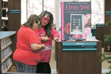 (ARCHIVE PHOTO | THE GRAHAM LEADER) Graham author Shelley Taylor shows off her book ‘With My Last Breath, I’d Say I Love You,’ during the 2023 Authors Day Book Festival at the Library of Graham. The event will be held this year from 10 a.m. to 1 p.m. Saturday, Dec. 7.