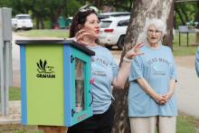 (THOMAS WALLNER | THE GRAHAM LEADER) Library of Graham Director DeAnna Bullock speaks before a ribbon cutting ceremony Thursday, April 23 dedicating the Free Little Library at Firemen’s Park. The book sharing libraries are at four locations in Graham.