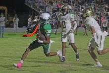 (ALEX HAVARDANSKY | THE GRAHAM LEADER) London Martinez takes a rushing attempt up the middle of the field for a touchdown Friday, Oct. 3 against Jayton. Martinez scored the second and final touchdown of the game for Newcastle. 