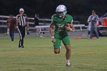 (THOMAS WALLNER | THE GRAHAM LEADER) Mikey Soito runs away from defenders for the Newcastle Bobcats. Soito is a veteran presence for the Bobcats as a senior on the team.