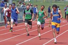 (BRIAN SMITH | JACKSBORO HERALD-GAZETTE) London Martinez of the Newcastle Bobcats track and field team competes in the relay event at their area meet Monday, April 7.