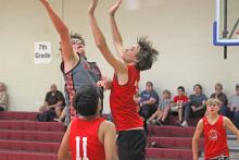 (ALEX HAVARDANSKY | THE GRAHAM LEADER) Nick Wankowicz jumps up to defend against a shot from Olney in their match Monday, Sept. 22. Wankowicz was pivotal for the Steers using his frame to box out defenders and create second chance opportunities offensively.