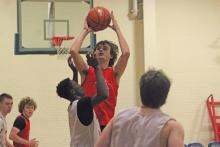(ALEX HAVARDANKSY | THE GRAHAM LEADER) Nick Wankowicz goes up over a defender for a layup Tuesday, Sept. 30, against Wichita Falls Christian. Wankowicz continues to be critical for the team’s rebounding and ability to create second chance opportunities.