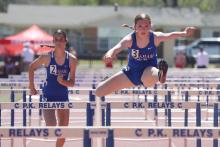 (KYLIE BAILEY | THE GRAHAM LEADER) Kate Hufstedler and Madison LeFevre compete in the 100-Meter Hurdles Big School 3A, 4A competition at the PK Relays held Saturday, March 21.