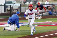 (THOMAS WALLNER | THE GRAHAM LEADER) Senior Tanner Hurford makes a mad dash for home as a player with the Jim Ned Indians scrambles for the ball in the background. The Steers finished out their season with a win Friday, April 24 over Glen Rose.
