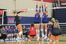 (ALEX HAVARDANSKY | THE GRAHAM LEADER) Rylee Moore (left) and Emily Hughes (right) go up for a block at the Lu Allen Tournament. Moore is one of the veteran leaders on the team and Hughes led the team in kills at the Denver City Tournament. 