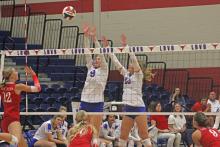 (ALEX HAVARDANSKY | THE GRAHAM LEADER) Rylee Moore, 9, and Emily Hughes, 10, go up for a block Friday, Sept. 26, against Glen Rose. Moore and Hughes combined for four blocks and 10 kills on the night.