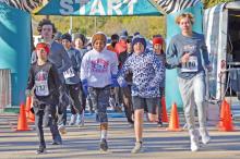 (FILE PHOTO | THE GRAHAM LEADER) Runners take off from the starting line in the 2022 Spivey Hill Challenge at Firemen’s Park in Graham. The event this year will be held Saturday, Nov. 11.