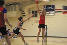 (ALEX HAVARDANKSY | THE GRAHAM LEADER) Jagger Nees shoots a three pointer from the top of the arc Tuesday, Oct. 14 against Jacksboro. Nees has grown as a solid shooter and distributor for the Steers.